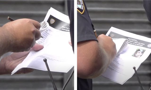 An NYPD Officer seen holding a photo of Derrick Ingram labeled labeled "Facial Identification Section Informational Lead Report"